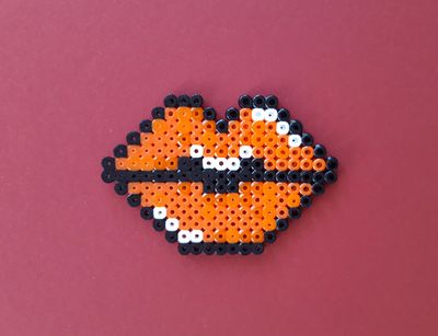 puckered lips made of iron-on beads