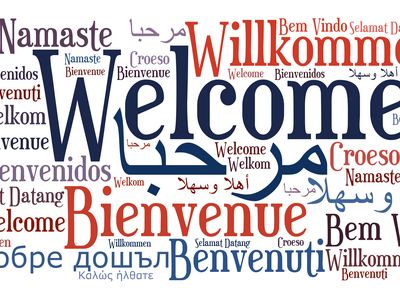 Collage aus dem Wort „Willkommen“ in verschiedenen Sprachen.