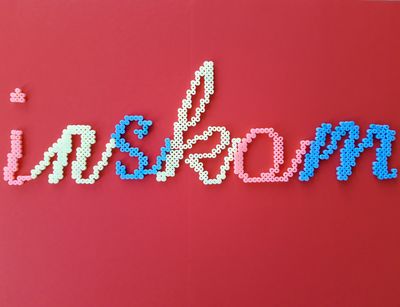 INSKOM handwriting made of iron-on beads